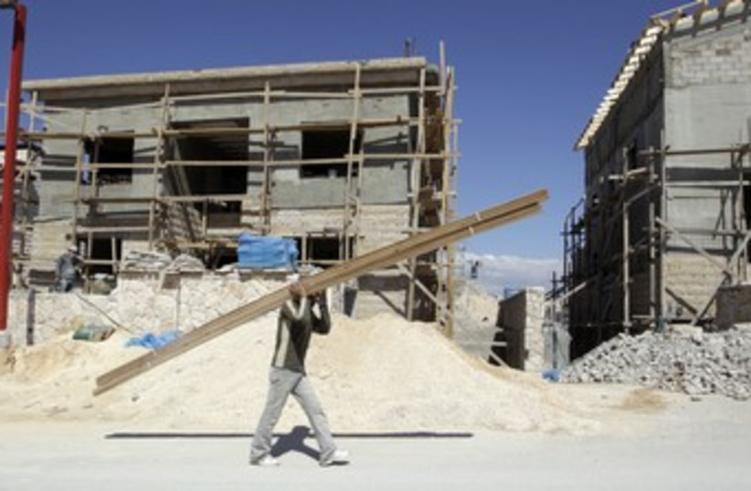 Palestinian laborer in Kedar_370 (photo credit: Ammar Awad/Reuters)
