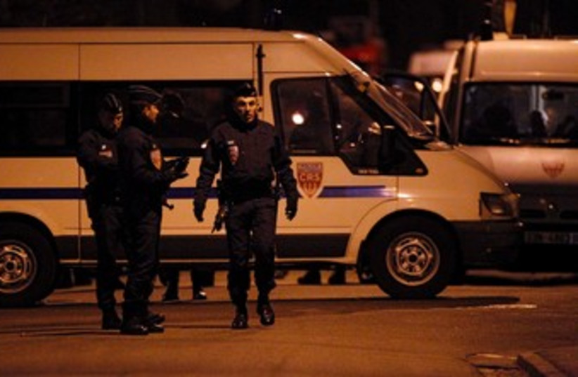 French police at scene of Toulouse standoff 370 (R) (photo credit: REUTERS/Jean-Paul Pelissier)