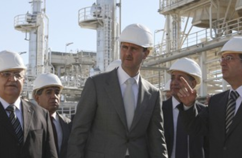 Assad tours natural gas plant near Homs_370 (photo credit: Reuters)