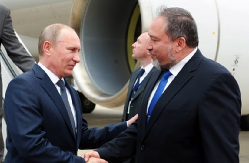 FM Liberman (right) greets Russian president at airport