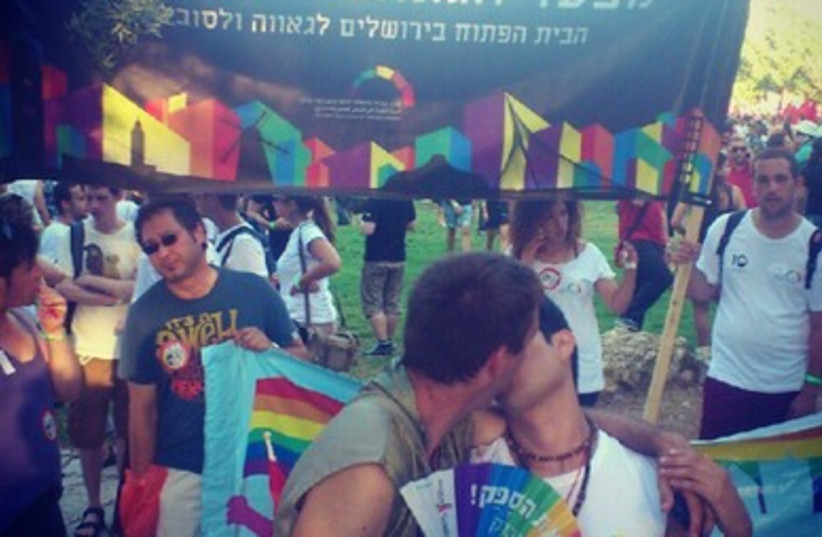 Gay couple kisses at J'lem Pride Parade
