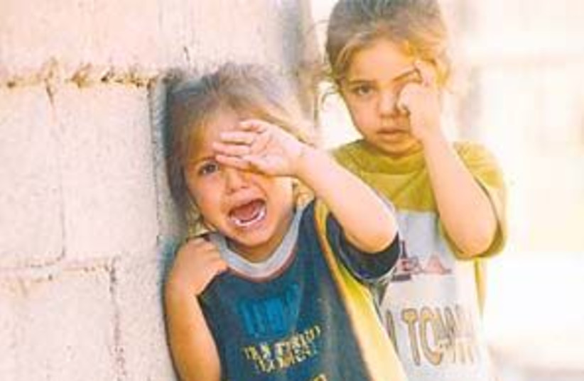 poor kids crying 298.88 (photo credit: Ariel Jerozolimski)