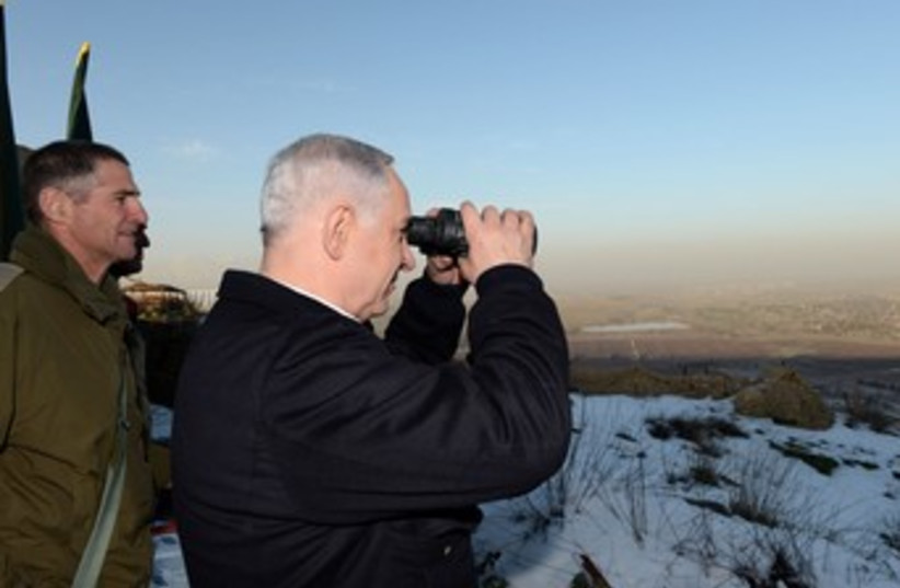 Netanyahu surveys Syrian border 370 (photo credit: Koby Gideon/GPO)