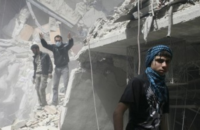 Syria strike 370 (photo credit: REUTERS/Aref Hretani)