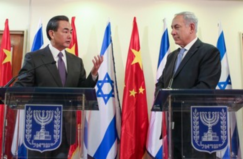Netanyahu and Chinese Foreign Minister Wang Yi 370 (photo credit: Pool/Noam Moskowitz)