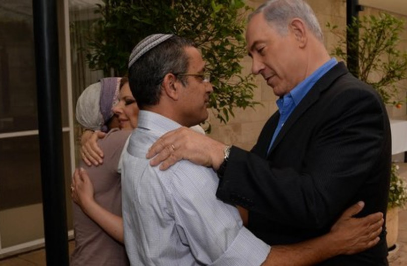 Prime Minister Binyamin Netanyahu and his wife Sara meet with the parents of the three kidnapped teens (photo credit: GPO)