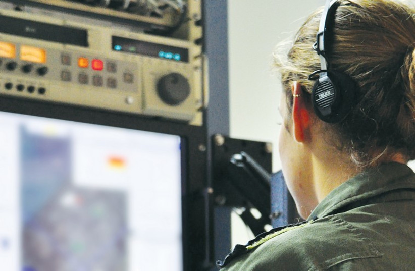 An officer monitors intelligence from Gaza in IAF headquarters. (photo credit: HAGAR AMIBAR)