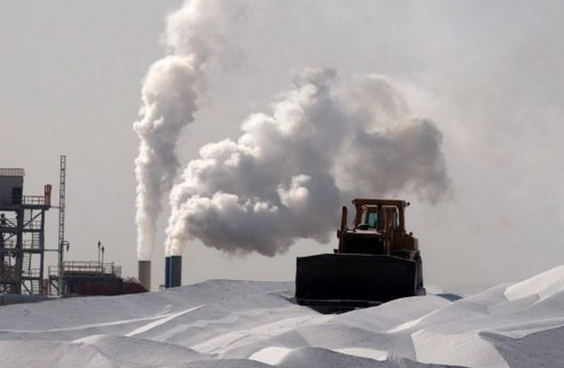 A bulldozer works at a magnesium factory near the Dead Sea.  (photo credit: REUTERS)