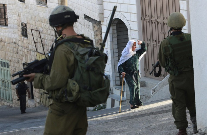 IDF soldiers patrol in Nablus [file] (photo credit: REUTERS)