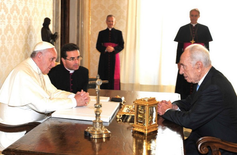 POPE FRANCIS and former president Shimon Peres chat at the Vatican (photo credit: Courtesy)