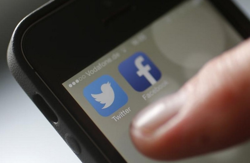 Social media apps Twitter and Facebook [Illustrative] (photo credit: REUTERS)