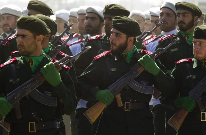 Members of Iran's Revolutionary Guards march during a parade to commemorate the anniversary of the Iran-Iraq war (1980-88), in Tehran September 22, 2010.  (photo credit: REUTERS)