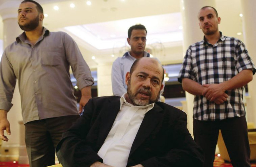 Deputy chairman of Hamas’s political bureau Musa Abu Marzouk talks during an interview in Cairo on August 9. (credit: REUTERS)