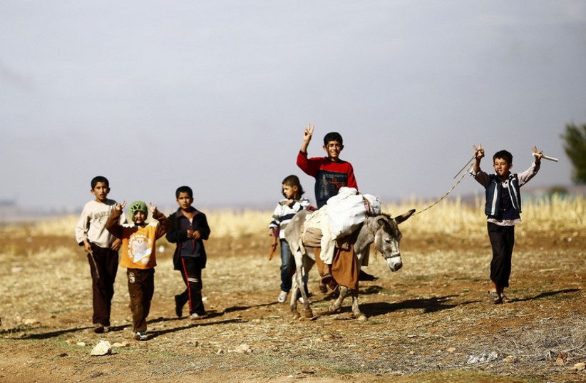 Christian refugees flee ISIS (photo credit: REUTERS)