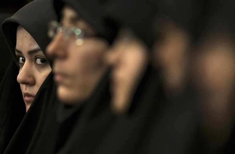 An Iranian woman attends a religious conference in Tehran (photo credit: REUTERS)