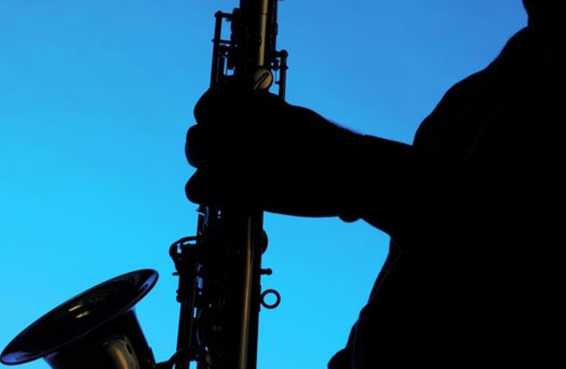 Silhouette of a musician playing the saxophone (credit: INGIMAGE)