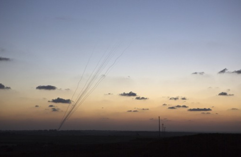 Smoke trails are seen as rockets are launched towards Israel from the northern Gaza Strip (photo credit: REUTERS)