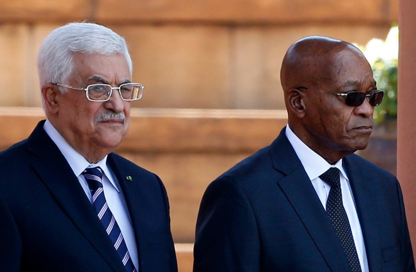 Palestinian Authority President Mahmoud Abbas (L) stands with South Africa's President Jacob Zuma at the Union Building in Pretoria November 26, 2014. (photo credit: REUTERS)