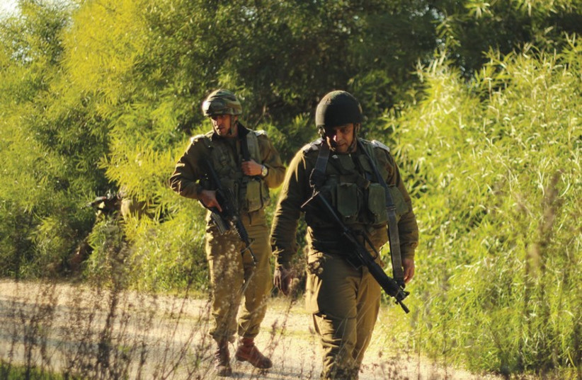 An IDF Beduin tracker on patrol. Unlike other minorities that serve in the army, for Beduin, service is on a volunteer basis. (photo credit: IDF SPOKESMAN’S UNIT)