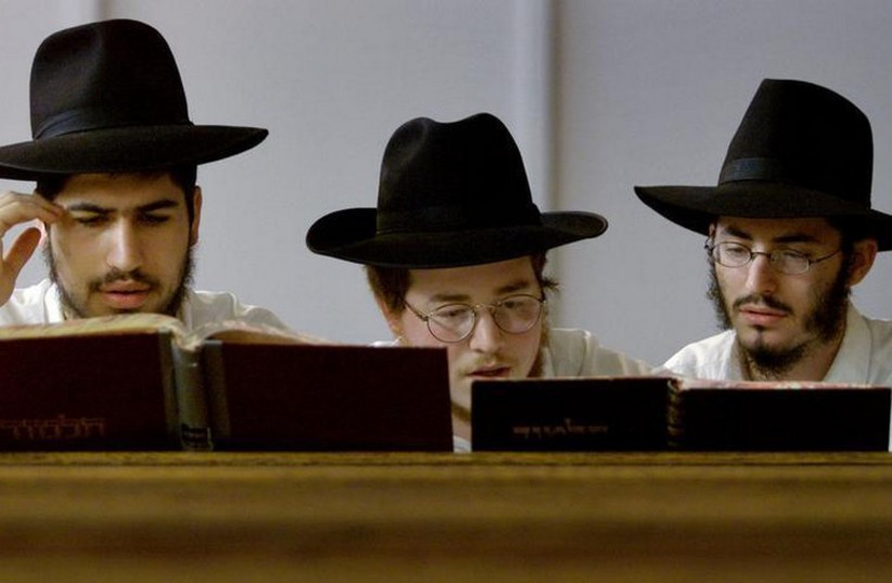 Yeshiva students pray in a synagogue in the Sydney suburb of Bondi (photo credit: REUTERS)