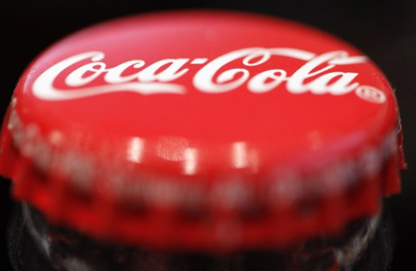 A logo is seen on a Coca-Cola bottle  (credit: REUTERS)