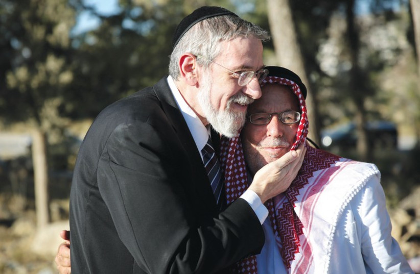 A rabbi and a sheikh at a prayer session for Muslims and Jews in Gush Etzion. (photo credit: ELIAZ COHEN)