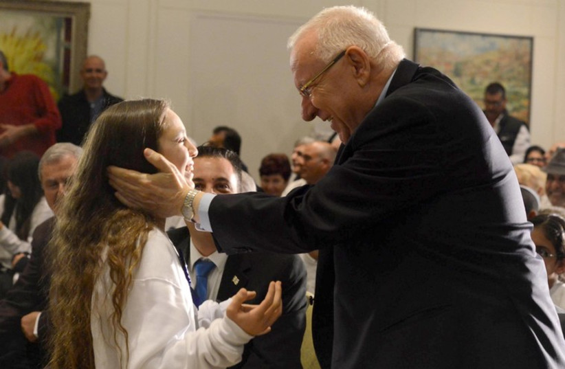 Pres. Rivlin  at the 13th annual Bar/Bat Mitzvah ceremony at the President’s Residence for boys and girls who were either injured themselves or who lost a parent or whose parents were permanently injured in a terrorist incident. (photo credit: Courtesy)