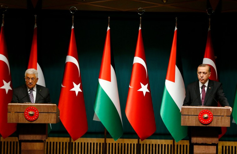 Turkey's President Tayyip Erdogan and Palestinian President Mahmoud Abbas (L) address the media at the Presidential Palace in Ankara January 12, 2015. (photo credit: REUTERS)