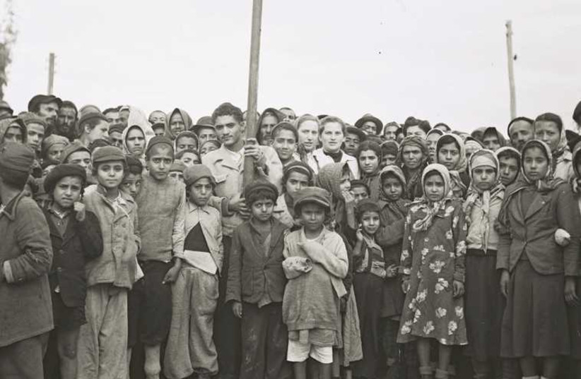 Yemenite immigrants gather for a photo at Rosh Ha’ayin, in the early years of the state. (credit: ILLUSTRATIVE: GPO FLICKR)