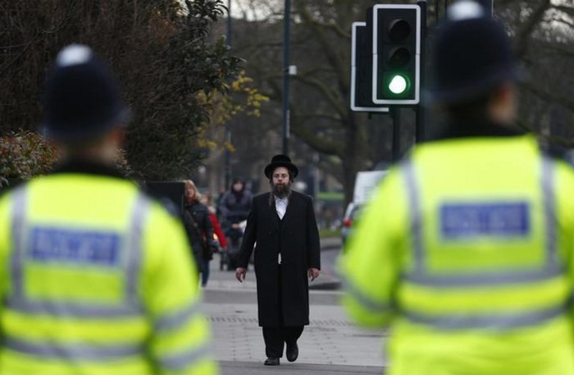 A member of the Jewish community walks in north London (photo credit: REUTERS)