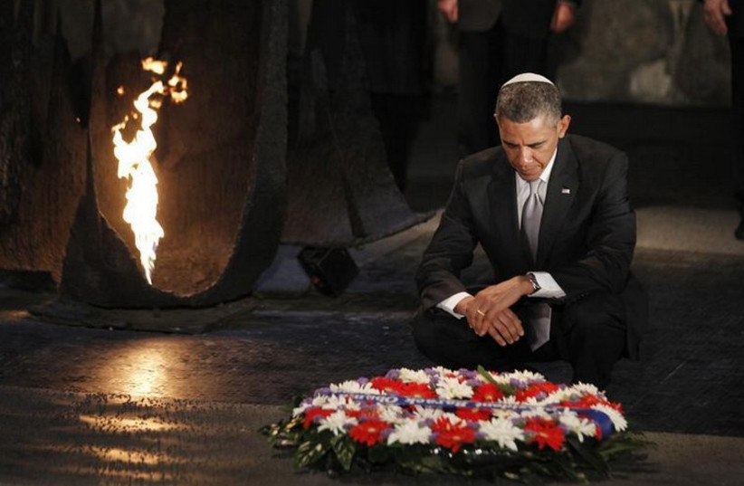 US President Barack Obama pauses for a moment as he lays a wreath at the Hall of Remembrance during his visit to Yad Vashem (photo credit: REUTERS)