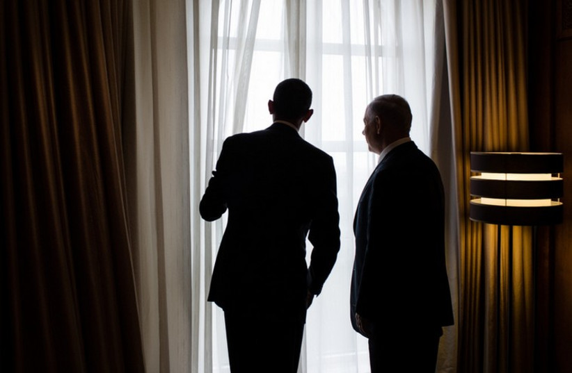 US President Barack Obama and Prime Minister Benjamin Netanyahu look out a window (photo credit: OFFICIAL WHITE HOUSE PHOTO BY PETE SOUZA)