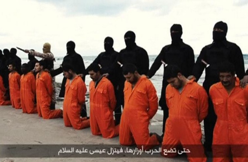 Egyptian Christians in orange jumpsuits just before their execution by ISIS henchmen (photo credit: REUTERS)