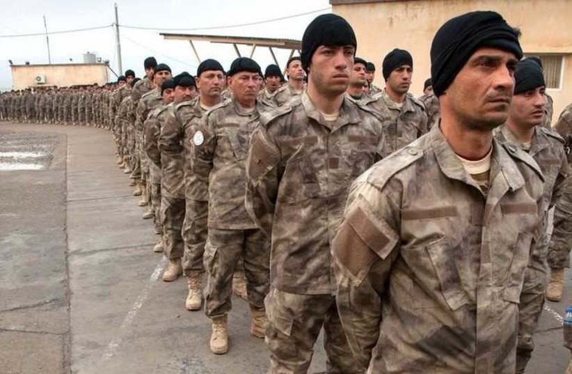 Soldiers from the Nineveh Plains Protection Units, a military organization created last year in Iraq to defend and retake Assyrian Christian land conquered by Islamic State (photo credit: JNS.ORG)
