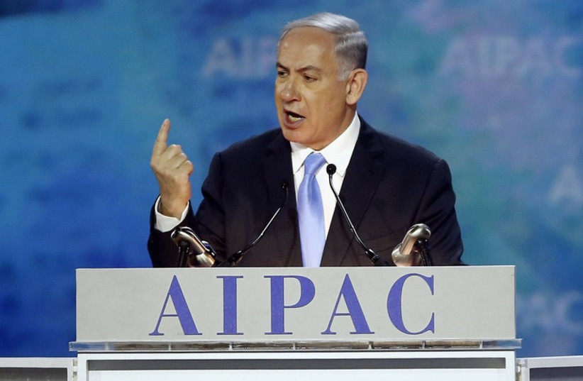 Israel's Prime Minister Benjamin Netanyahu gestures as he addresses the American Israel Public Affairs Committee (AIPAC) policy conference in Washington, (photo credit: REUTERS)