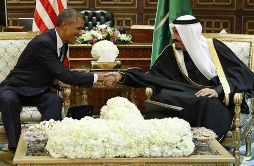 US President Barack Obama (L) shakes hands with Saudi Arabia's King Salman at the start of a bilateral meeting at Erga Palace in Riyadh (photo credit: REUTERS)