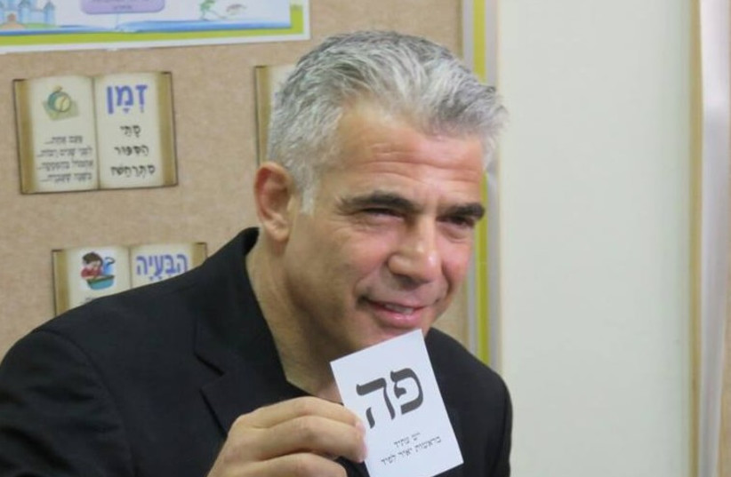 Yesh Atid leader Yair Lapid votes, March 17, 2015 (photo credit: PR)