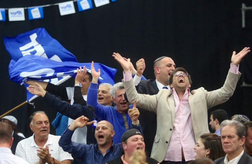 Likud supporters celebrate at party headquarters on Election Day (photo credit: MARC ISRAEL SELLEM/THE JERUSALEM POST)