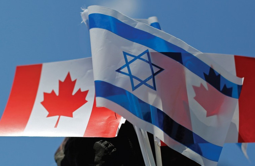 The flags of Israel and Canada (credit: REUTERS)