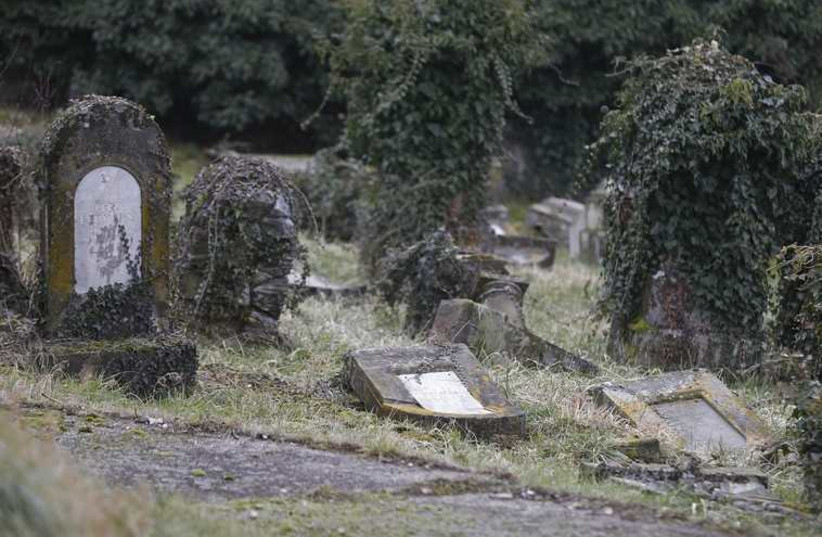 Desecrated tombstones of a Jewish cemetery  (Illustrative) (photo credit: REUTERS)