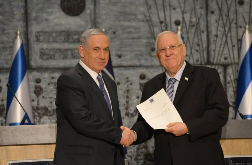 President Reuven Rivlin tasks Prime Minister Benjamin Netanyahu with forming Israel’s 34th government, March 25 (photo credit: PRESIDENTIAL SPOKESPERSON OFFICE)