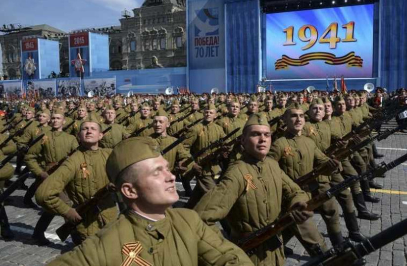 Russian servicemen in historical Red Army uniforms march during the Victory Day parade at Red Square in Moscow