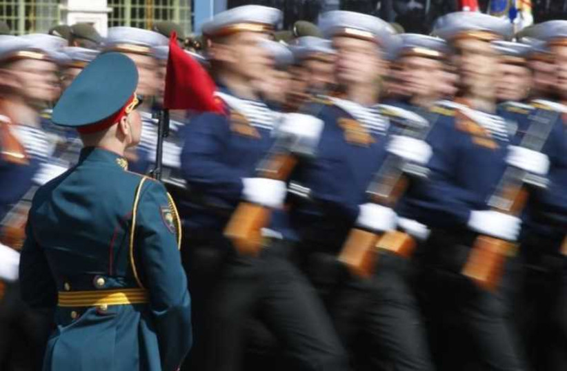 Russian servicemen dressed in Red Army navy uniforms march during the Victory Day parade at Red Square in Moscow