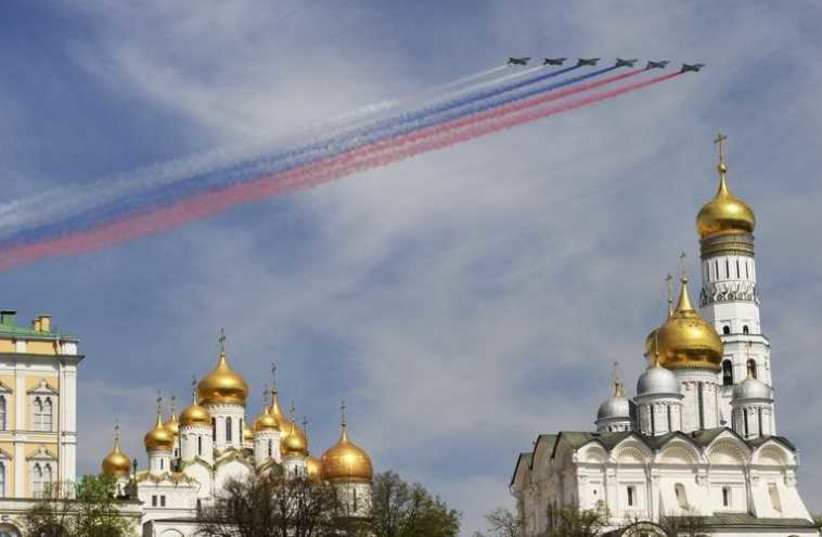 Russian Sukhoi Su-25 Frogfoot ground-attack planes fly in formation over the Red Square during the Victory Day parade in Moscow