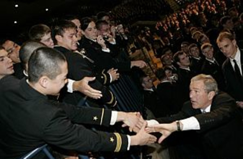 bush with troops 298 (photo credit: AP)