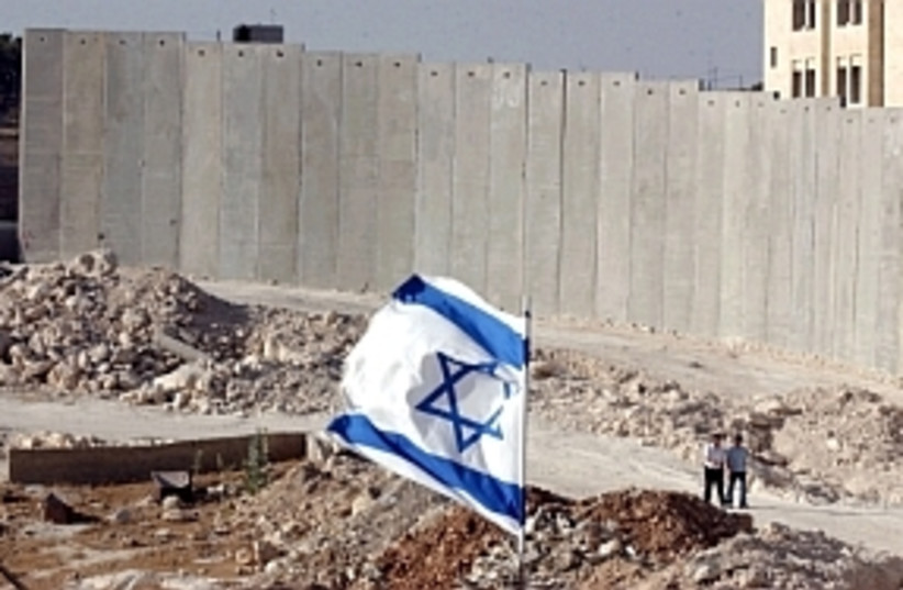 fence with flag 298  (photo credit: Ariel Jerozolimski [file])
