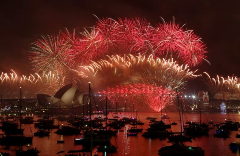 Fireworks explode over the Sydney Opera House and Harbour Bridge as Australia's largest city ushers in the New Year