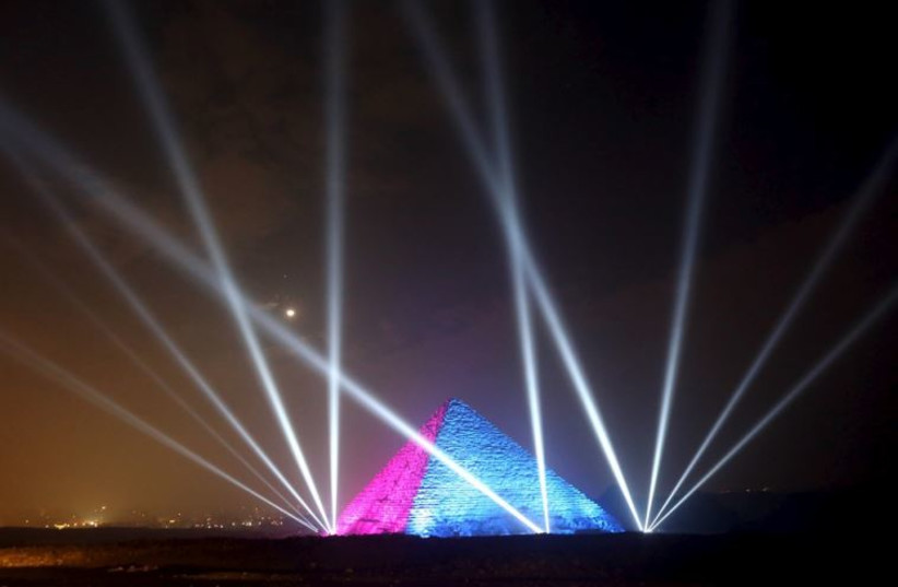 Egyptians celebrate in front of great pyramids during New Year's day celebrations on the outskirts of Cairo
