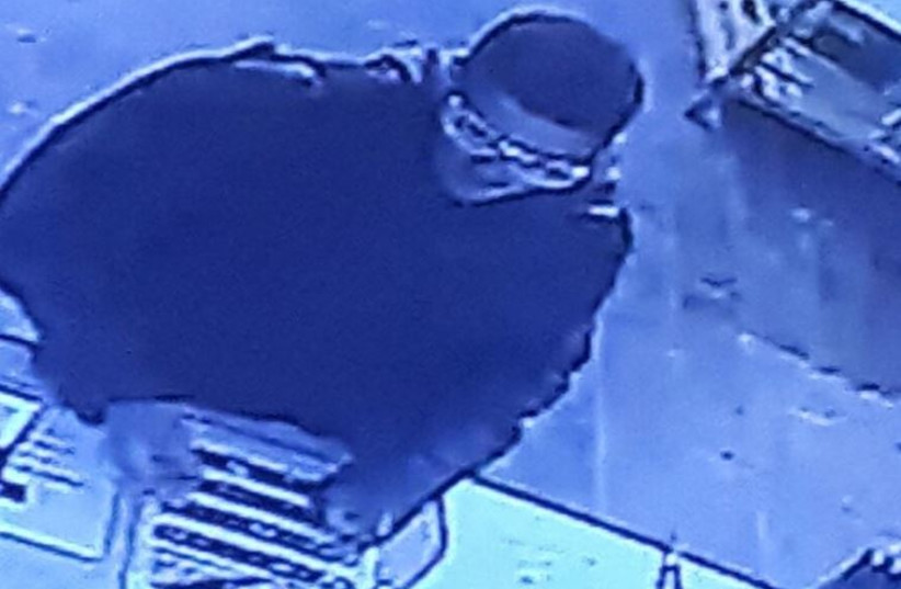 The suspect is seen on closed-circuit television just moments before opening fire on Dizengoff Street in Tel Aviv