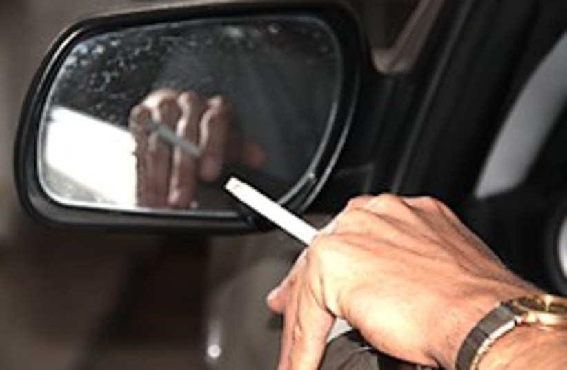smoker in car 248.88 (photo credit: Tovah Lazaroff)